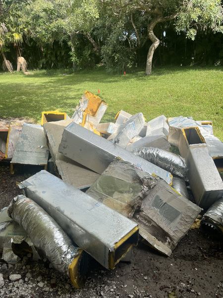 Old ductwork torn out and piled up for removal