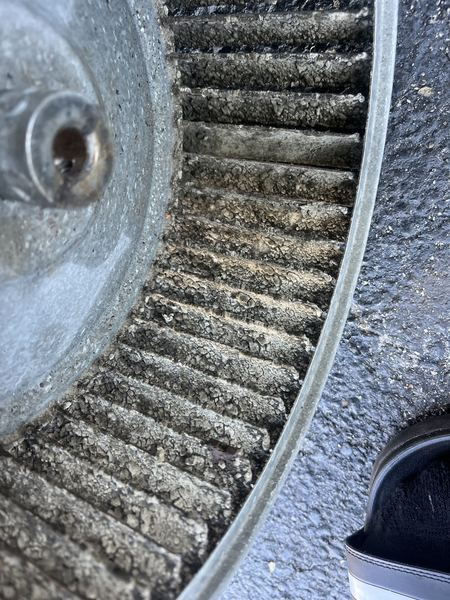 Blower wheel caked with dirt before cleaning